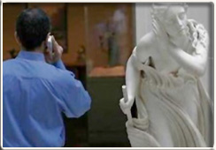 statue listening to phone conversation